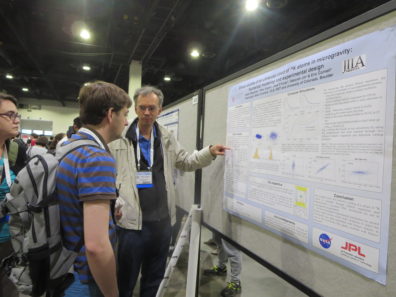 PI Dr. Peter Engels explaining Efimov physics to a curious passer-by at the poster session.